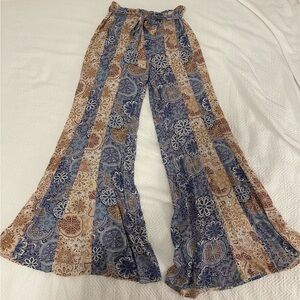 comfy hippie style pants with elastic waistband in the back and a fabric “belt”